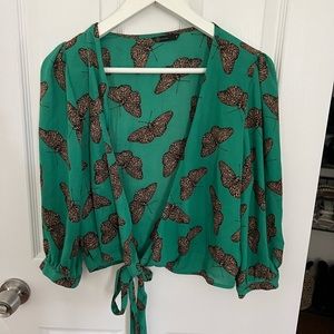 Green tie-up long sleeve shirt with butterfly accents